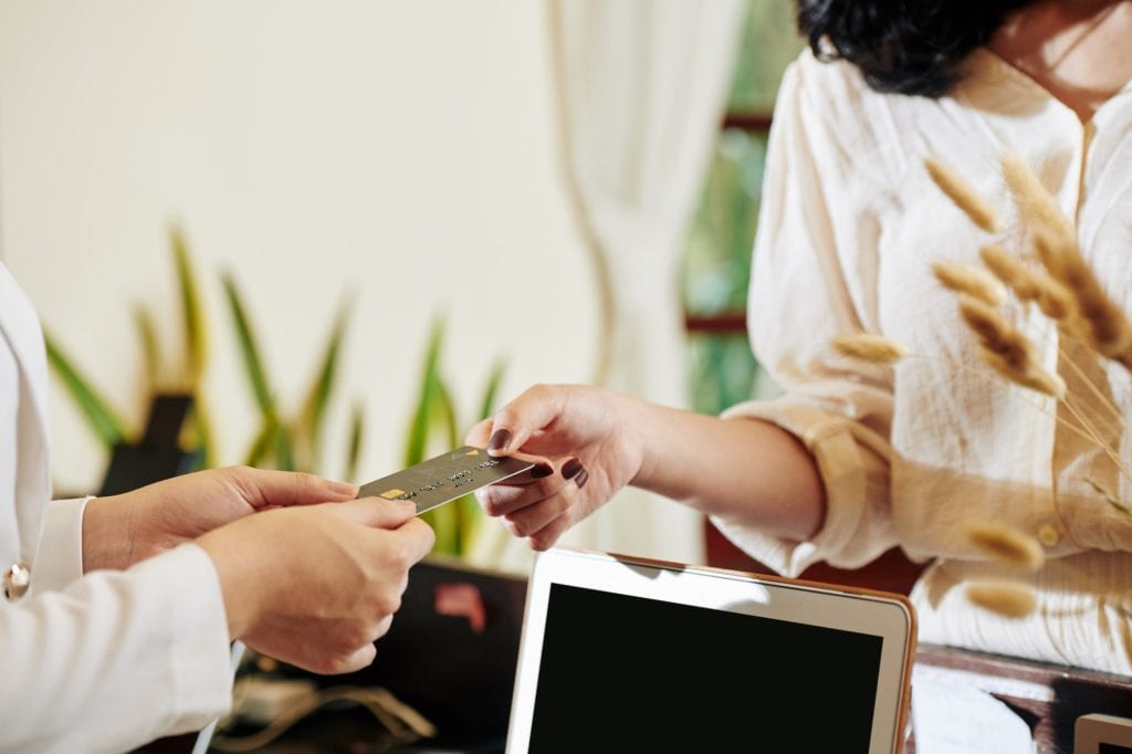 Hotel guest paying for service